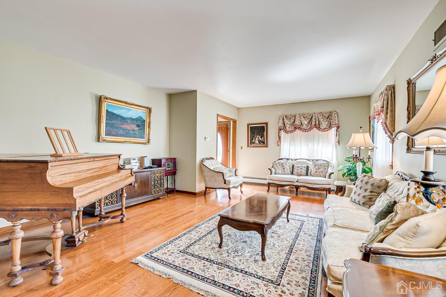 7 Paley Place Edison, NJ 08817 - Photo 15 of 53 a living room with furniture a rug and a window