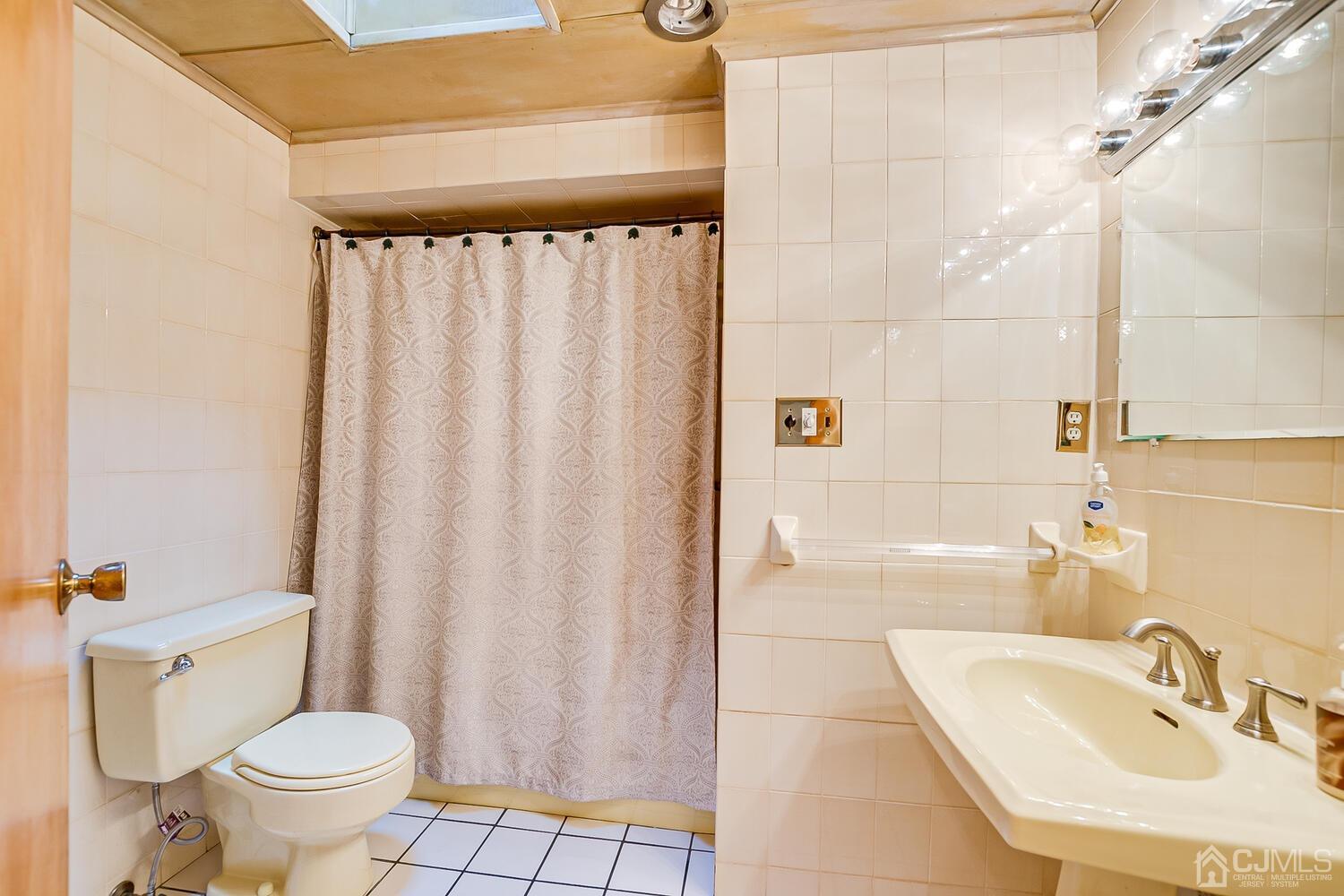 7 Paley Place Edison, NJ 08817 - Photo 22 of 53 a bathroom with a sink toilet and shower