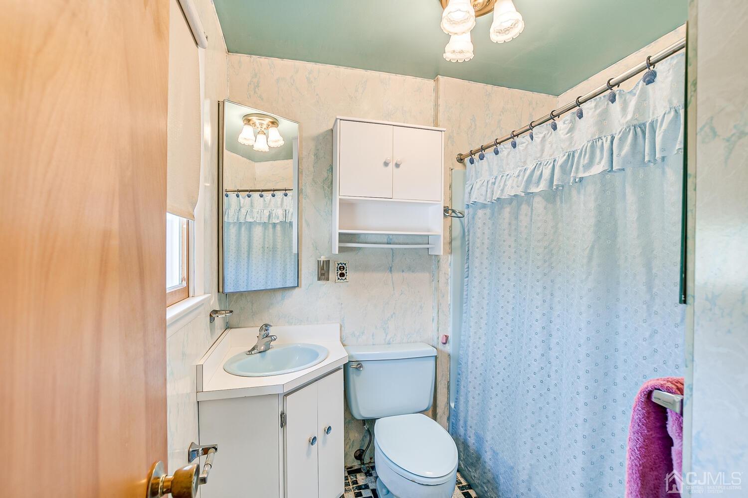 7 Paley Place Edison, NJ 08817 - Photo 27 of 53 a bathroom with a sink a toilet and shower