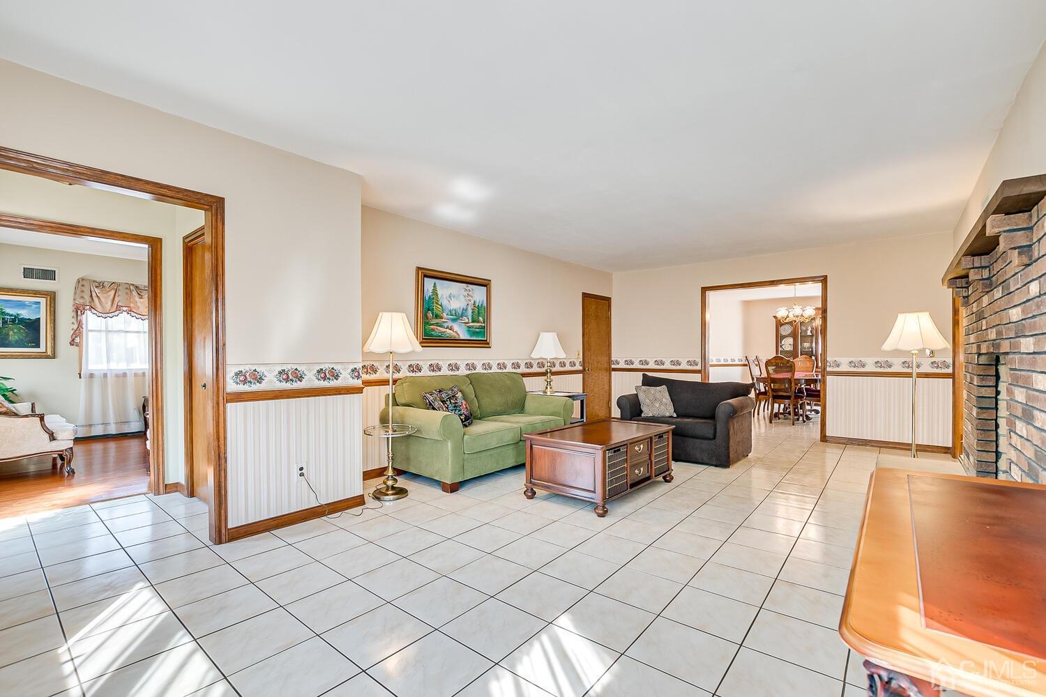 7 Paley Place Edison, NJ 08817 - Photo 6 of 53 a living room with furniture and a table