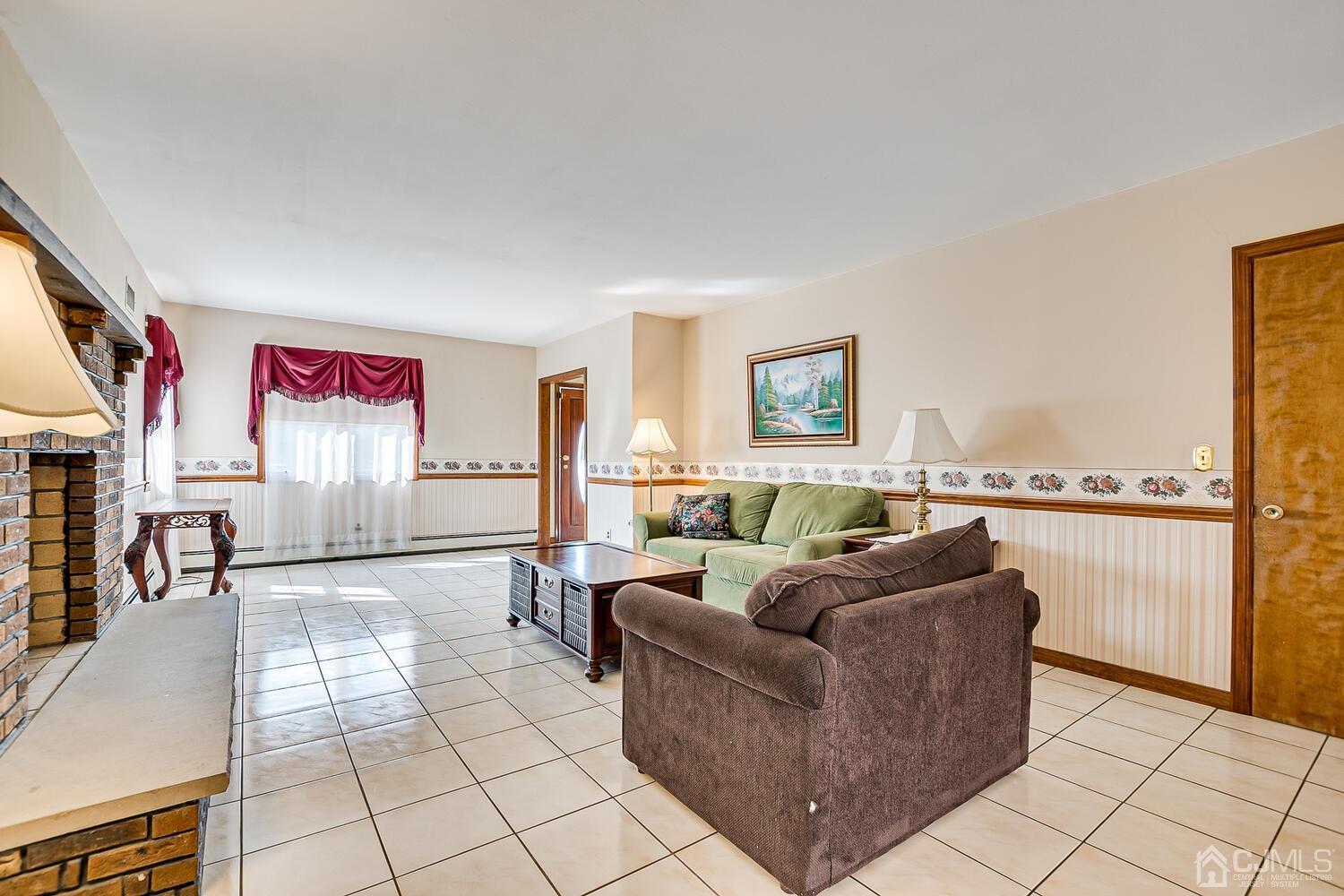 7 Paley Place Edison, NJ 08817 - Photo 7 of 53 a living room with furniture and a table