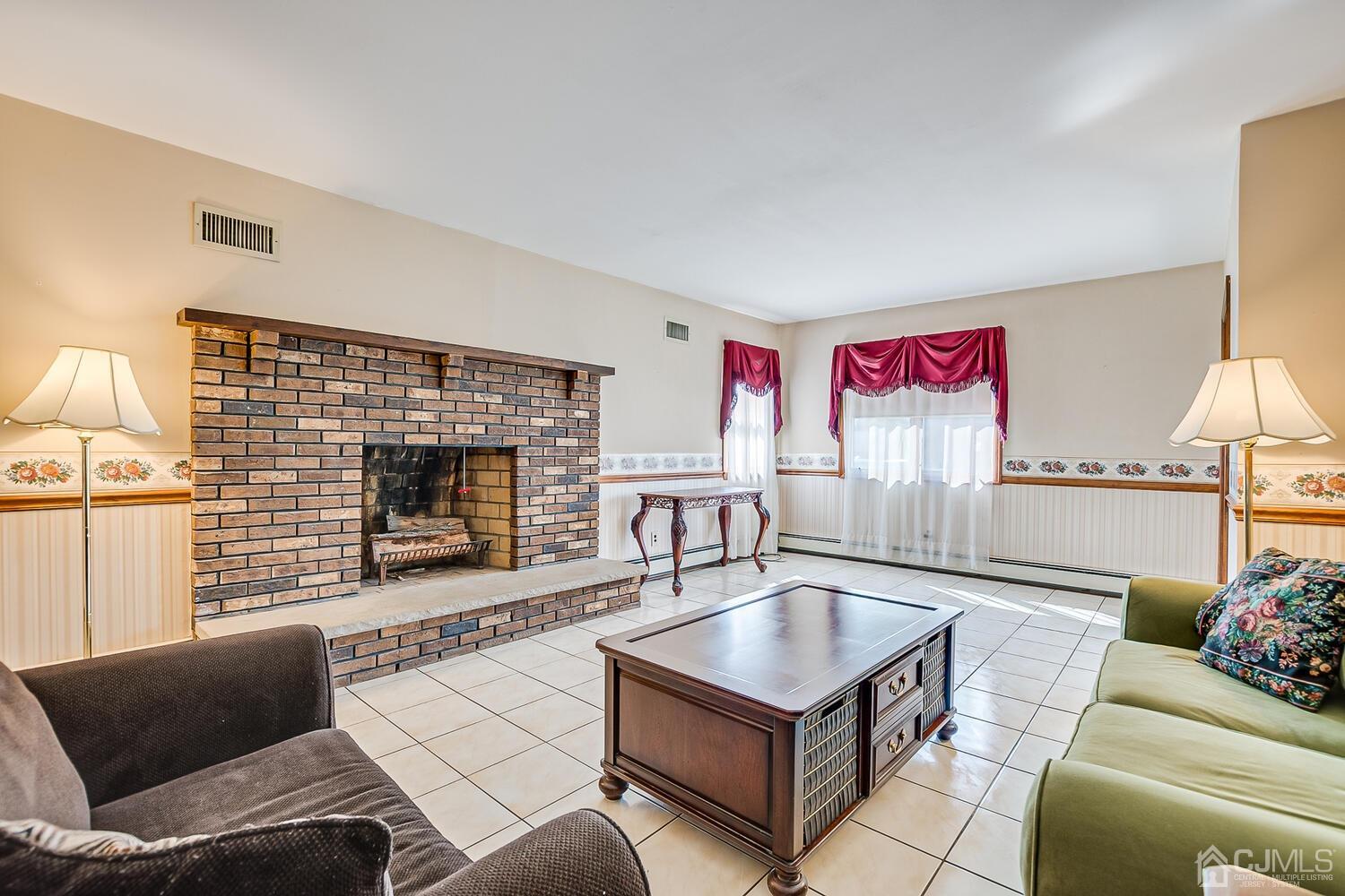 7 Paley Place Edison, NJ 08817 - Photo 8 of 53 a living room with furniture and a fireplace