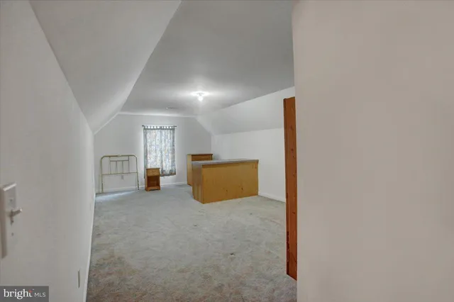 a view of a room with a hallway