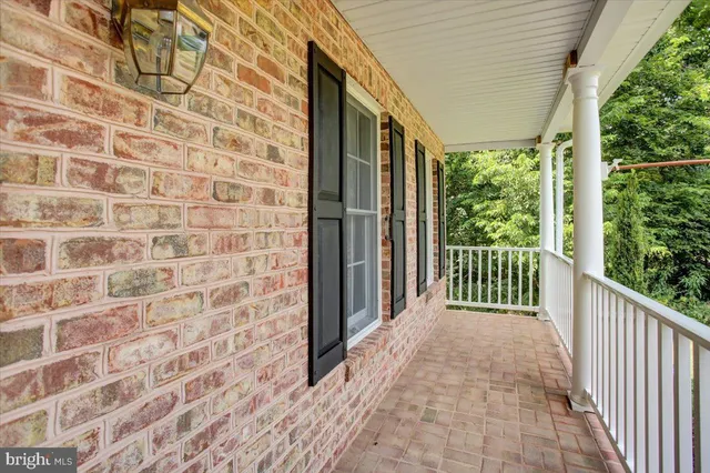a view of a porch with wooden floor and outdoor space