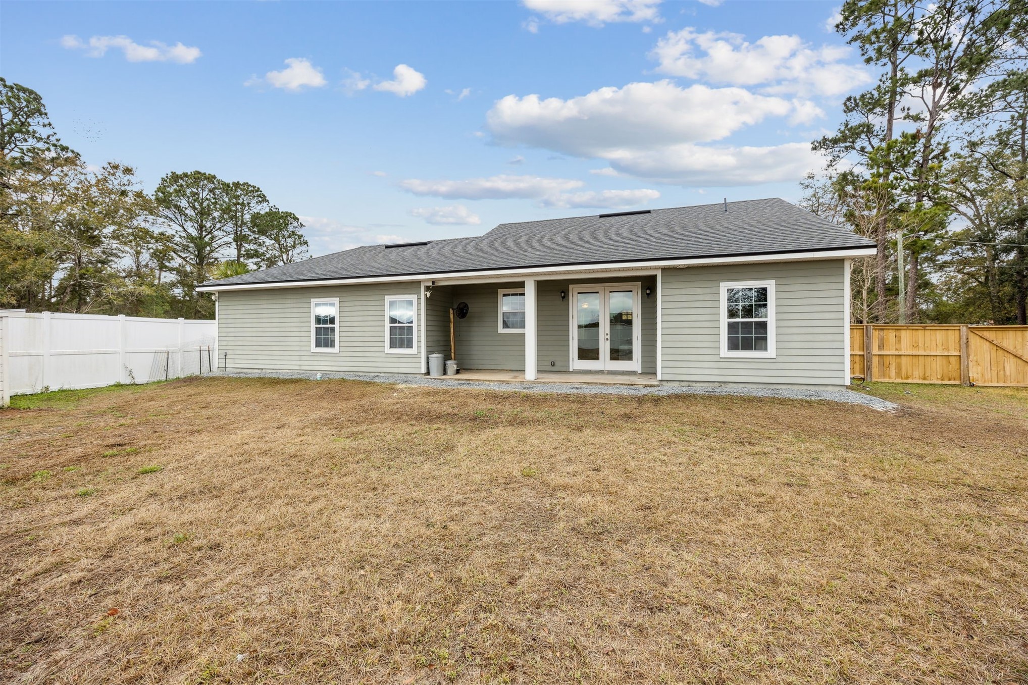 96718 Blackrock Road Yulee, FL 32097 - Photo 52 of 54 a house with trees in the background