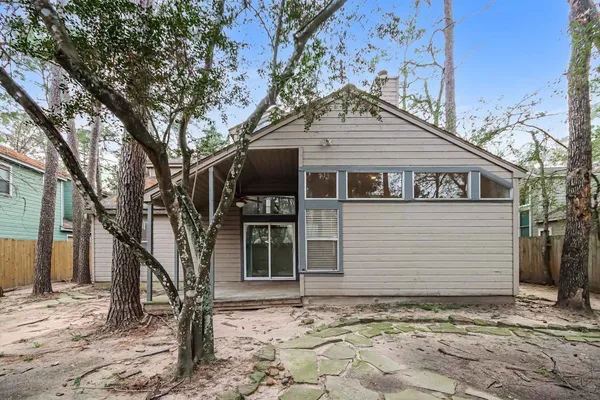 a house with trees in the background