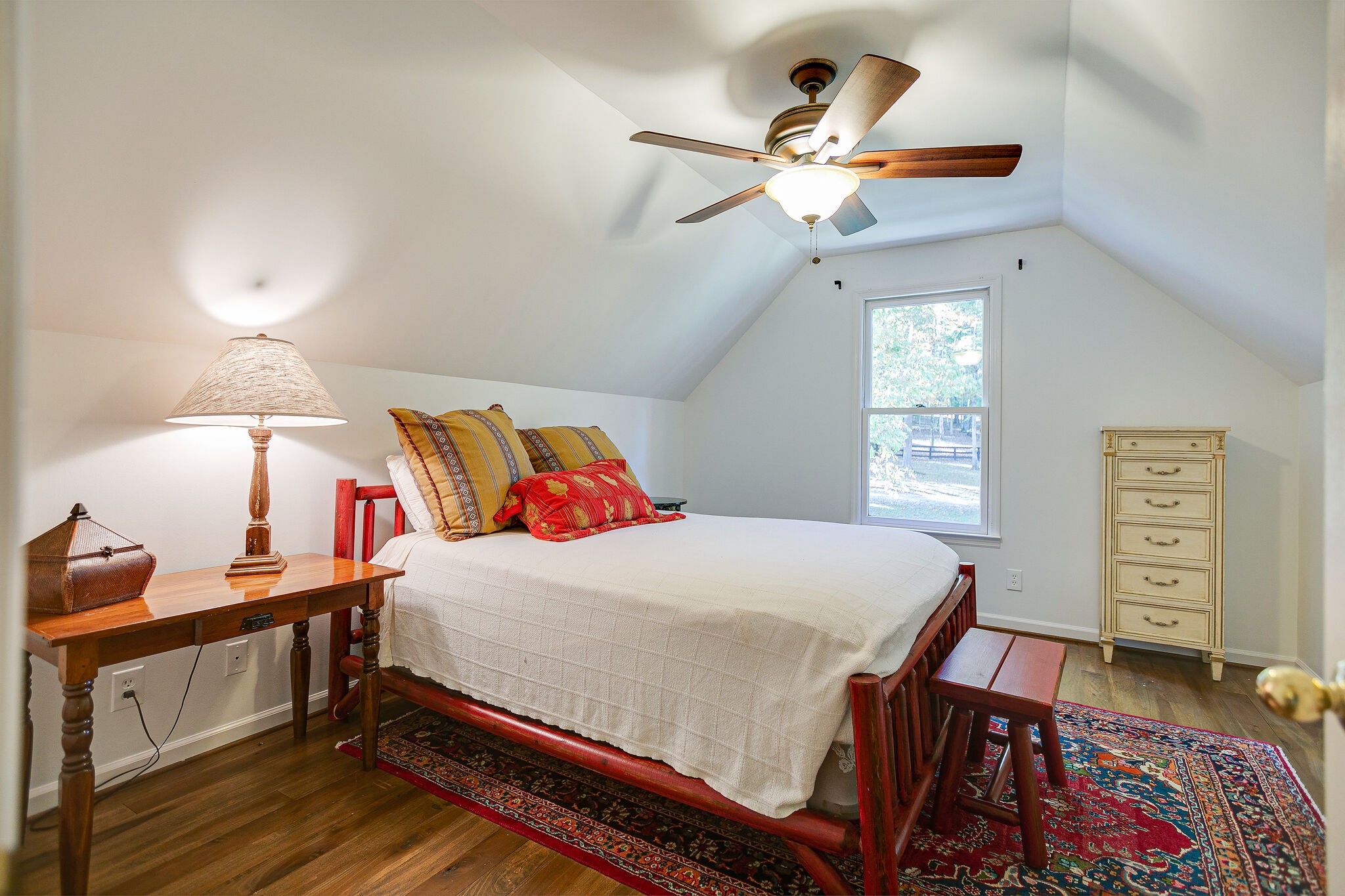 5629 Pinewood Road Franklin, TN 37064 - Photo 21 of 49 a bedroom with a bed and a chandelier