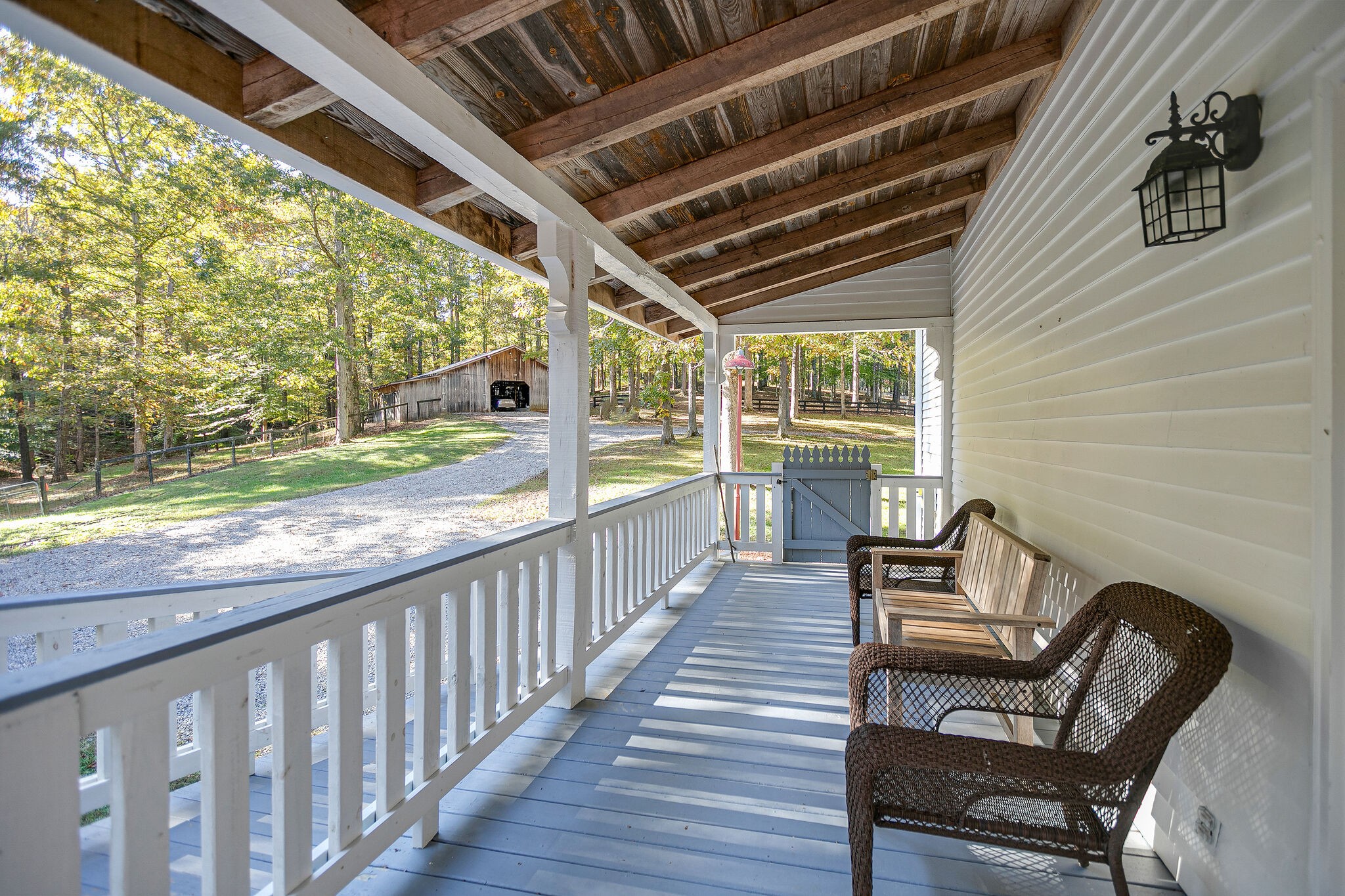 5629 Pinewood Road Franklin, TN 37064 - Photo 25 of 49 a view of a porch with furniture and a yard