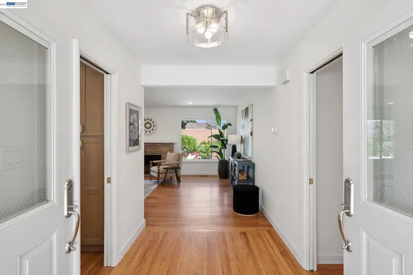 a living room with furniture and a lamp