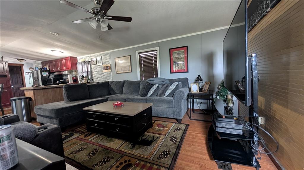 203 Colvin Road Greensboro, PA 15338 - Photo 5 of 20 a living room with furniture and wooden floor