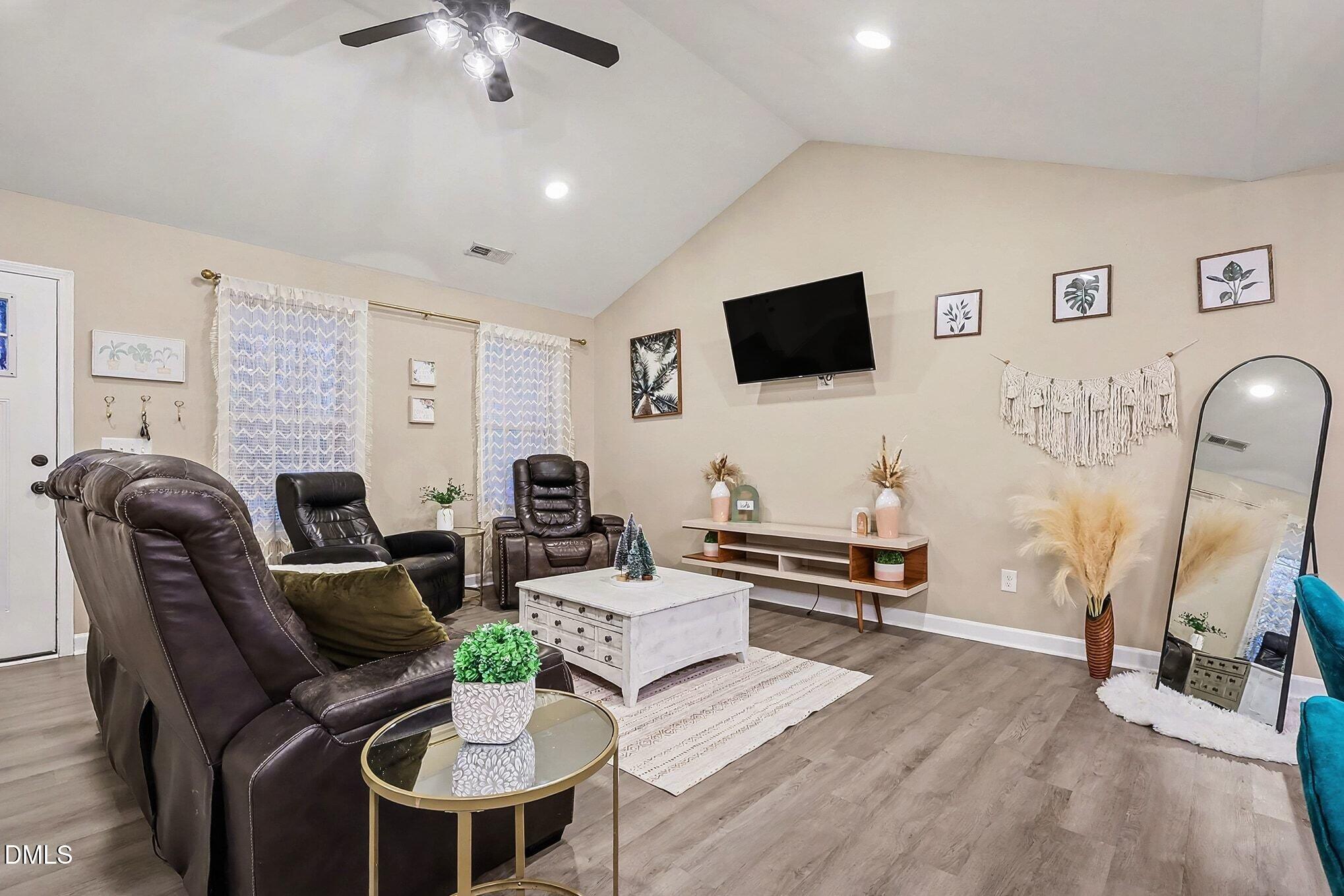 115 Southern High School Road Graham, NC 27253 - Photo 10 of 34 a living room with furniture and a flat screen tv