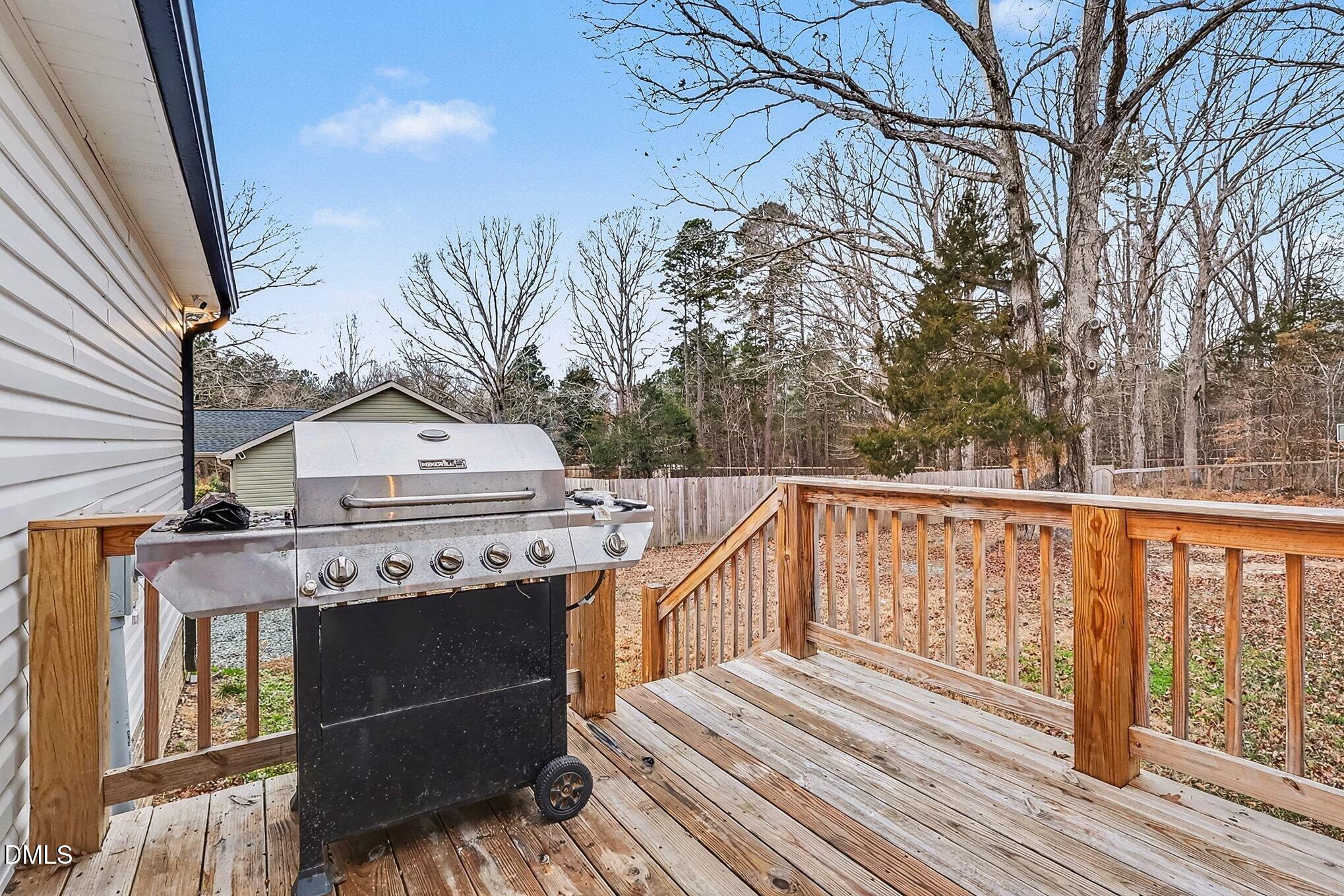 115 Southern High School Road Graham, NC 27253 - Photo 27 of 34 a view of a balcony with wooden floor and fence