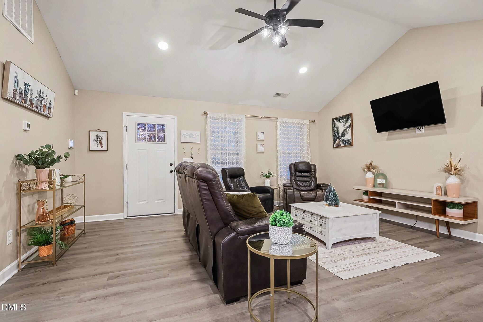 115 Southern High School Road Graham, NC 27253 - Photo 9 of 34 a living room with furniture and a flat screen tv