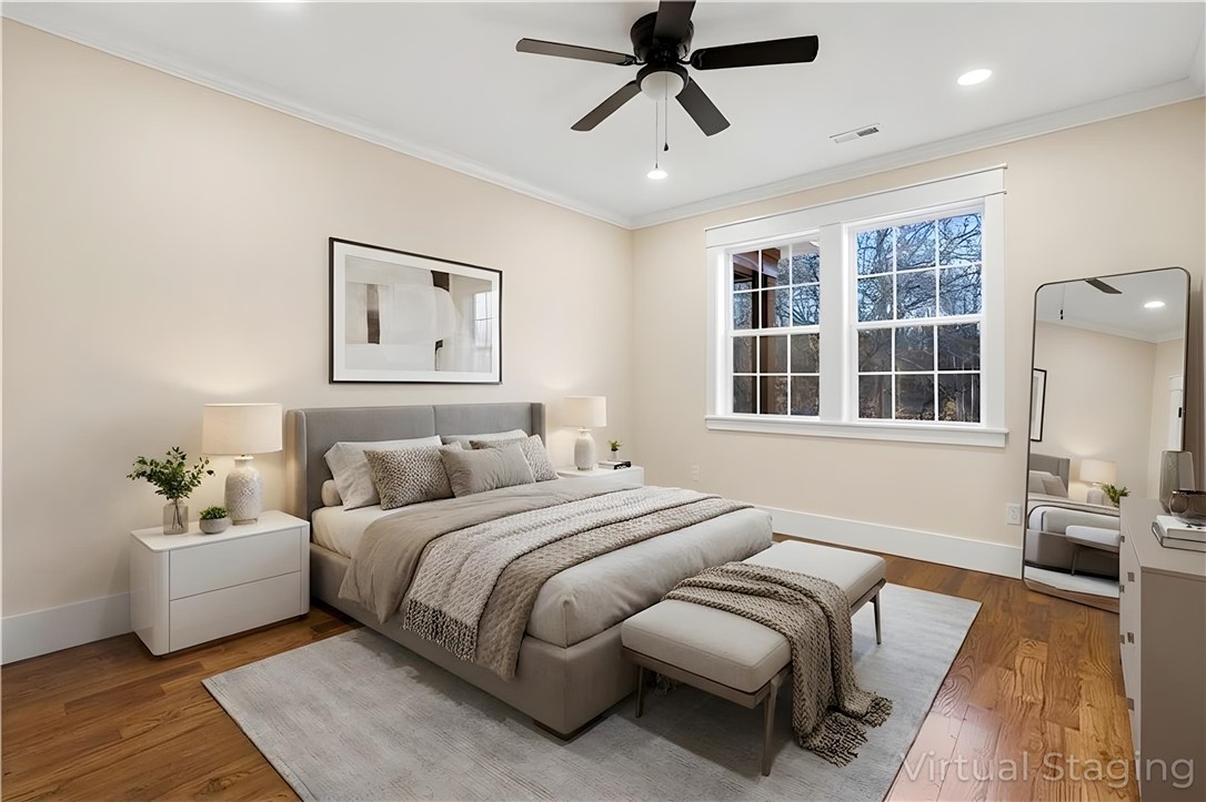 303 Regency Circle Anderson, SC 29625 - Photo 31 of 50 This primary bedroom features elegant wood floors and bright windows for a serene retreat.