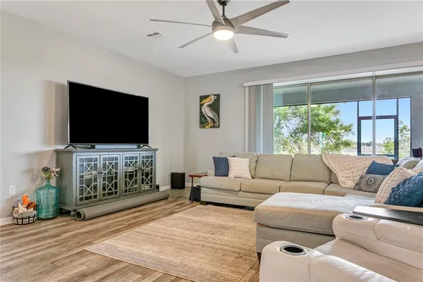 a kitchen with a sink a counter top space and a center island