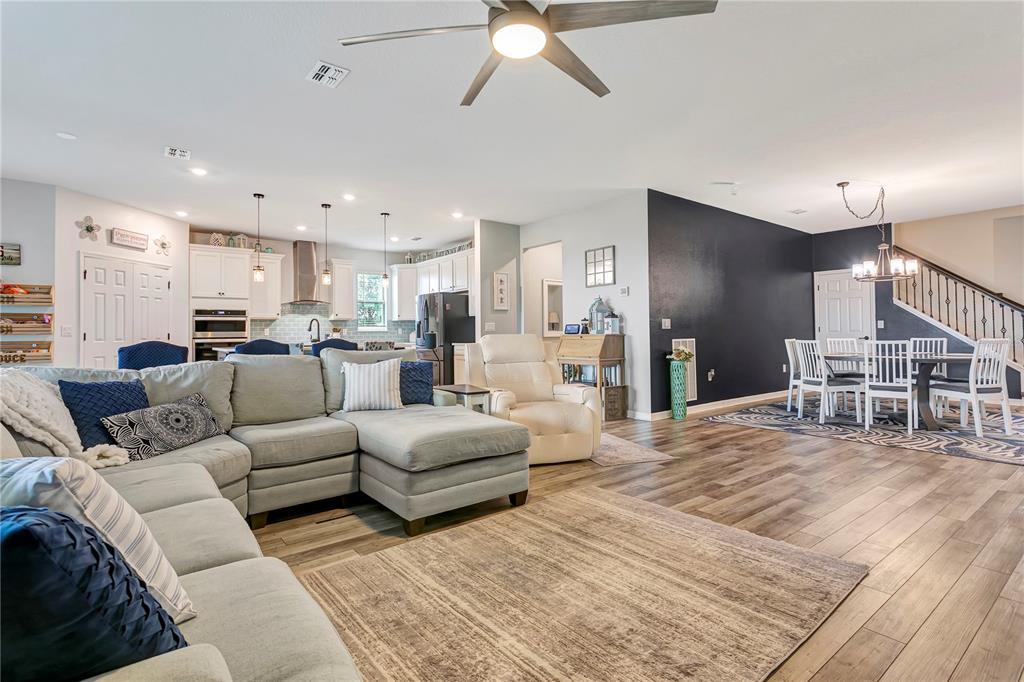 11701 Brighton Knoll Loop Riverview, FL 33579 - Photo 15 of 70 a living room with furniture and kitchen view