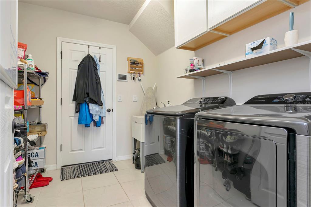 11701 Brighton Knoll Loop Riverview, FL 33579 - Photo 20 of 70 a view of walk in closet with clothes and shoes