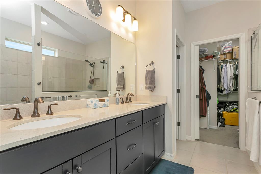 11701 Brighton Knoll Loop Riverview, FL 33579 - Photo 24 of 70 a bathroom with a double vanity sink and a mirror
