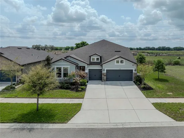 an aerial view of a house with a garden