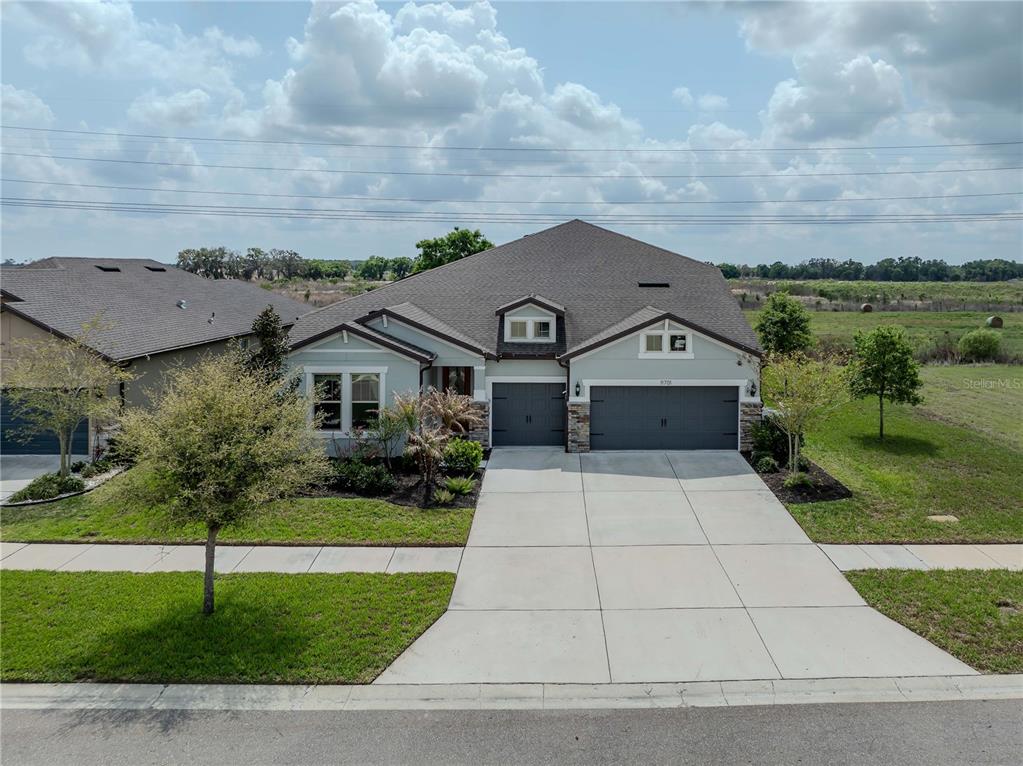11701 Brighton Knoll Loop Riverview, FL 33579 - Photo 3 of 70 a aerial view of house with yard and green space