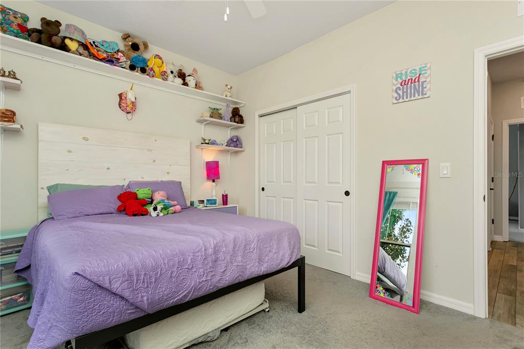 11701 Brighton Knoll Loop Riverview, FL 33579 - Photo 31 of 70 a bedroom with a bed and a white cabinet