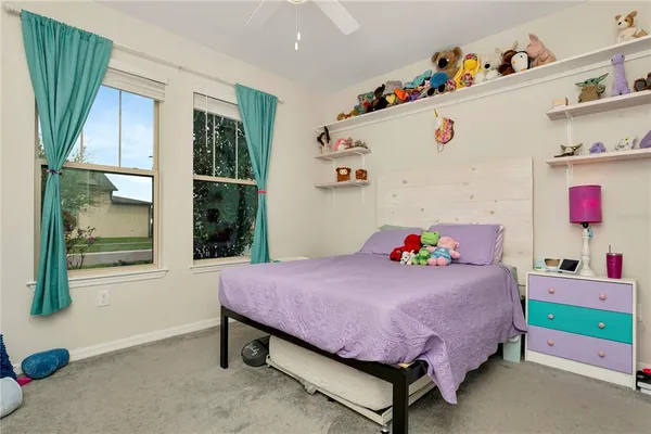 a view of a workspace with furniture and a flat screen tv