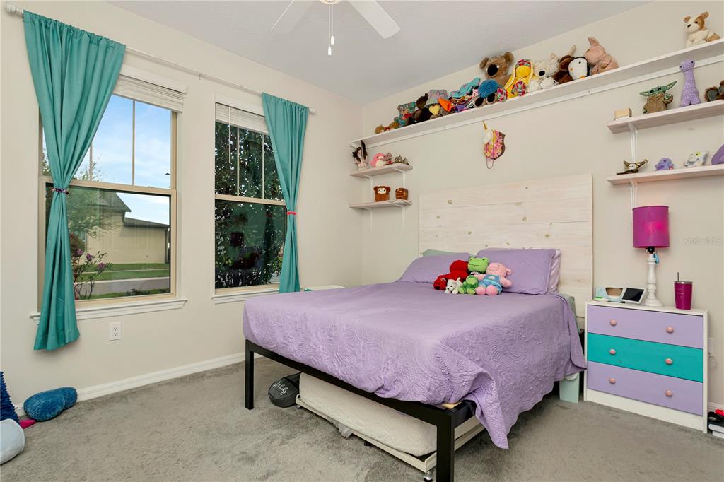 11701 Brighton Knoll Loop Riverview, FL 33579 - Photo 32 of 70 a bedroom with a bed and a window