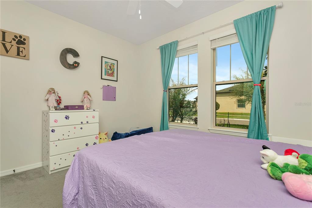 11701 Brighton Knoll Loop Riverview, FL 33579 - Photo 33 of 70 a bedroom with a bed and a window