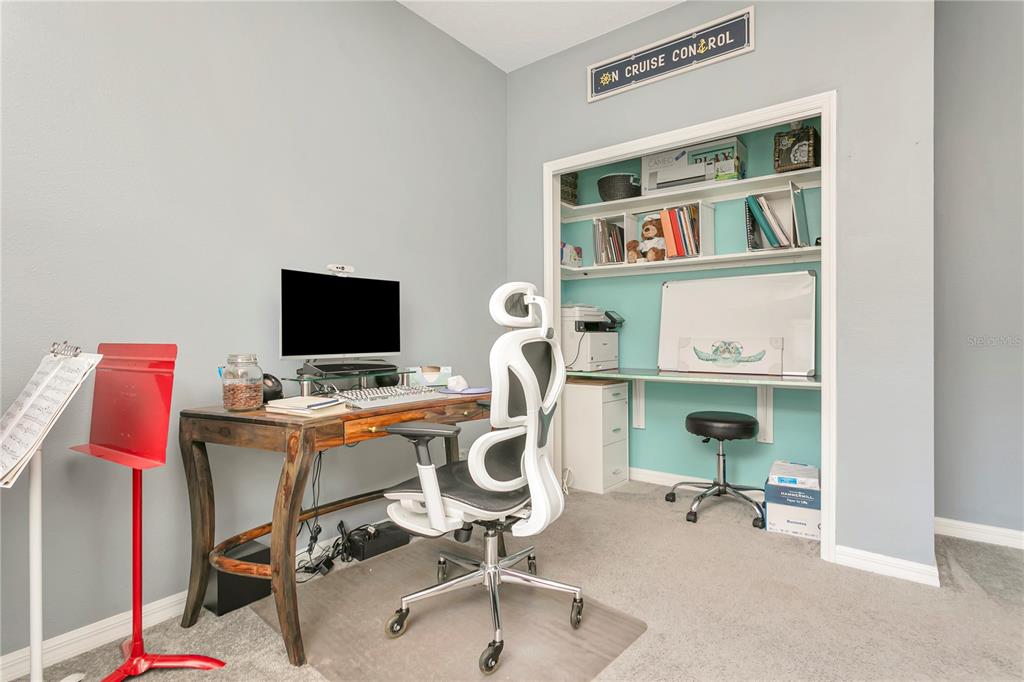 11701 Brighton Knoll Loop Riverview, FL 33579 - Photo 35 of 70 a view of a workspace with furniture and a window