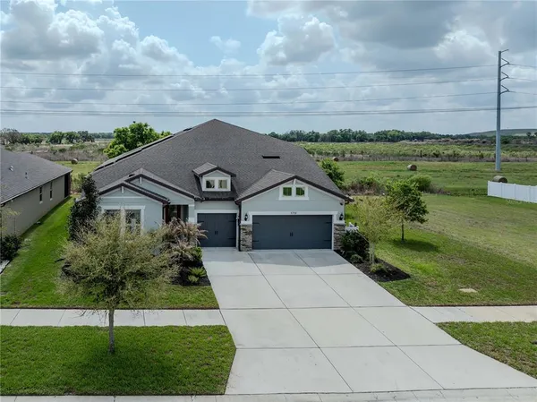 an aerial view of a house with a outdoor space