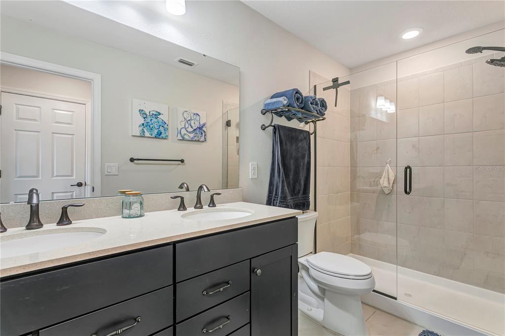11701 Brighton Knoll Loop Riverview, FL 33579 - Photo 42 of 70 a bathroom with a sink a toilet and shower