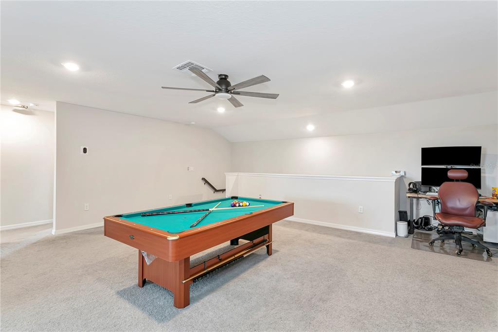 11701 Brighton Knoll Loop Riverview, FL 33579 - Photo 47 of 70 a living room with furniture pool table and a couch