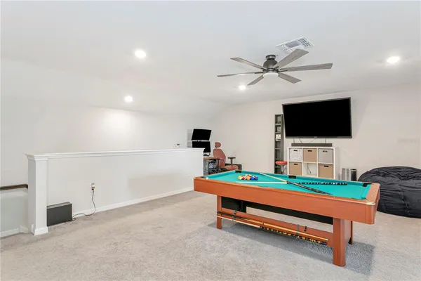 an aerial view of a swimming pool and outdoor space