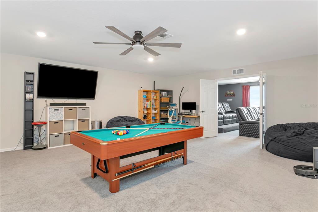 11701 Brighton Knoll Loop Riverview, FL 33579 - Photo 49 of 70 a room with furniture and a flat screen tv