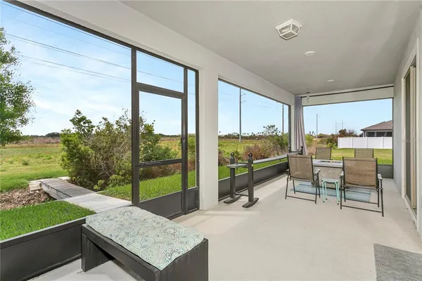 an aerial view of a house with a swimming pool