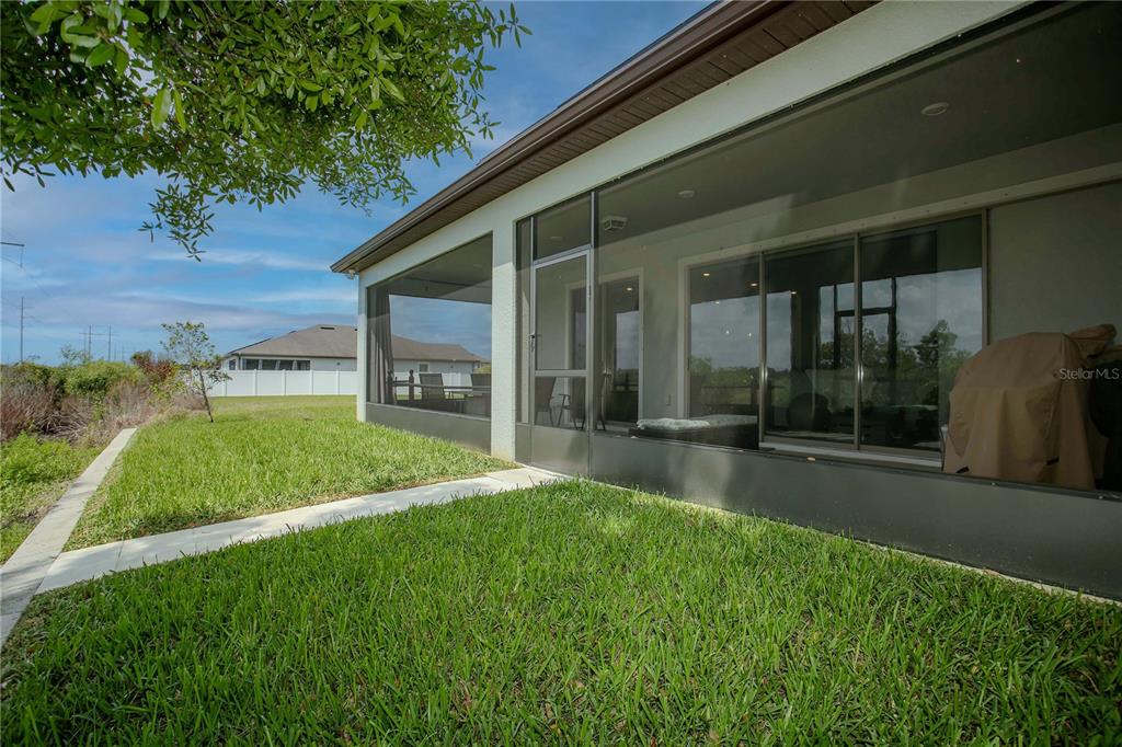 11701 Brighton Knoll Loop Riverview, FL 33579 - Photo 52 of 70 a view of a house with a yard and a large tree