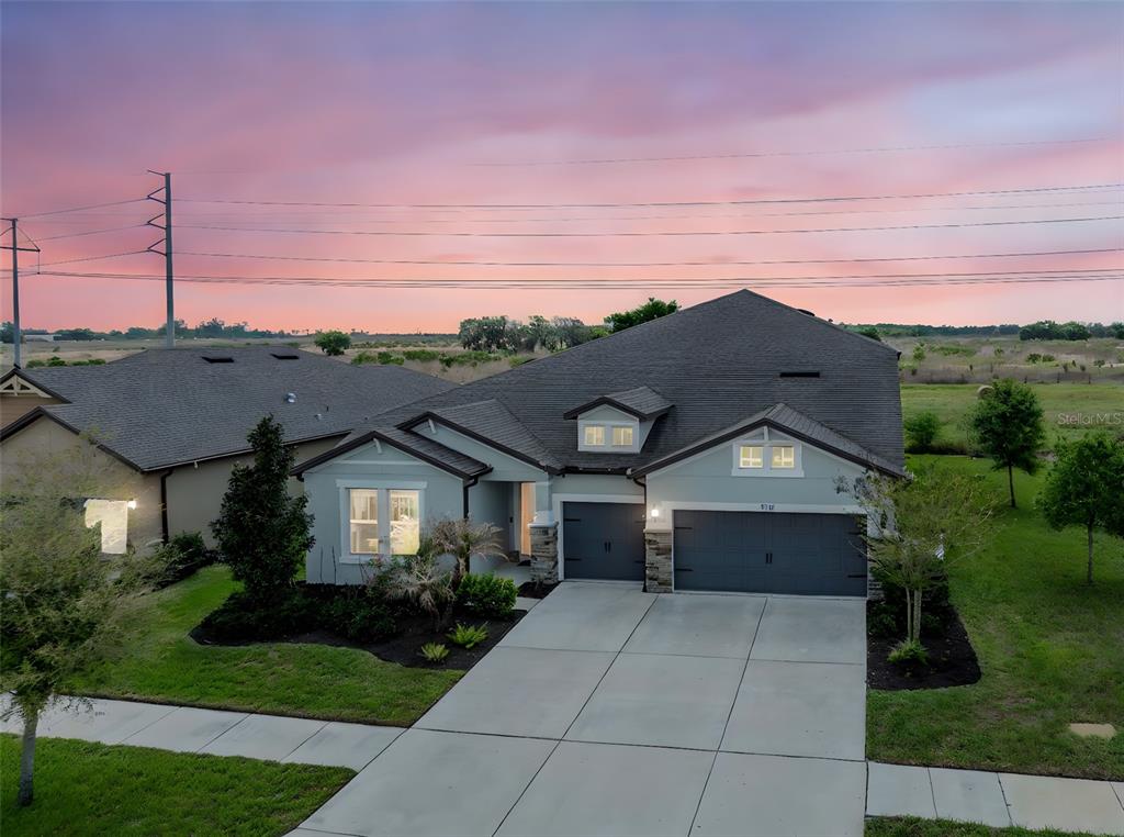 11701 Brighton Knoll Loop Riverview, FL 33579 - Photo 57 of 70 a front view of a house with a yard