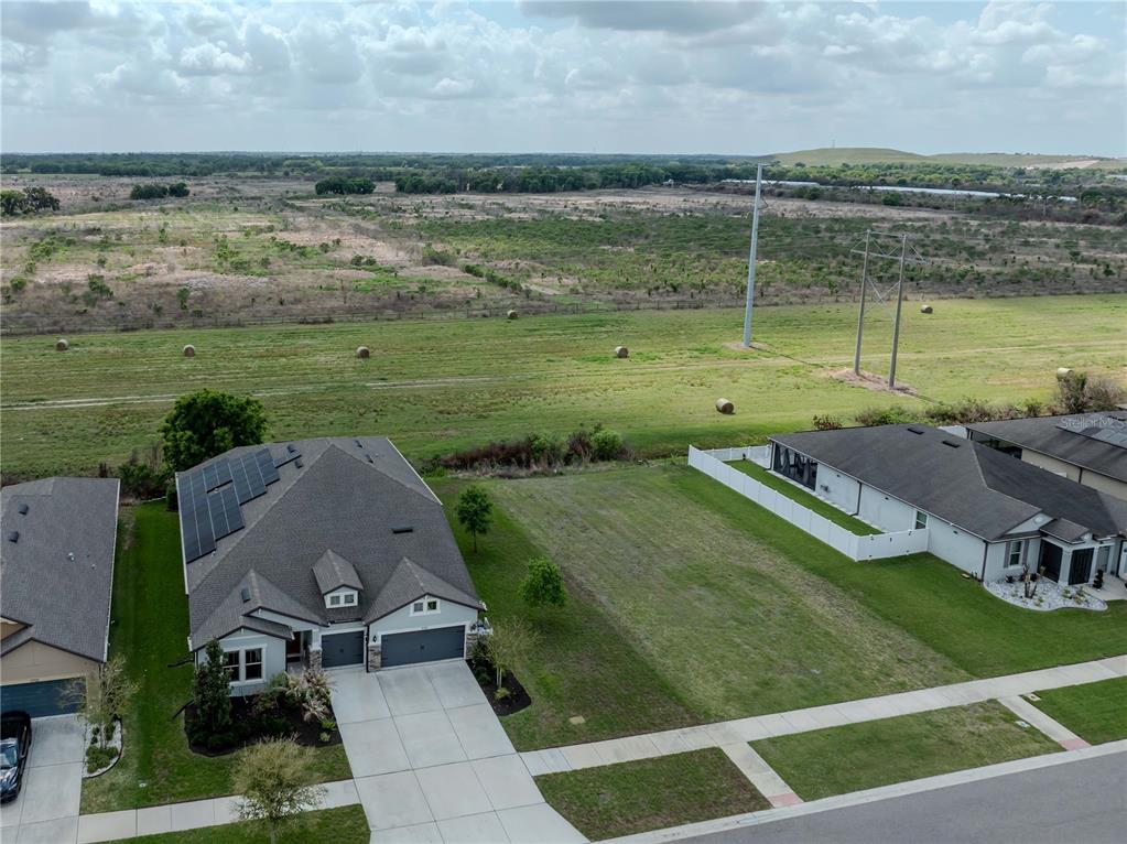 11701 Brighton Knoll Loop Riverview, FL 33579 - Photo 58 of 70 a view of a lake with a yard