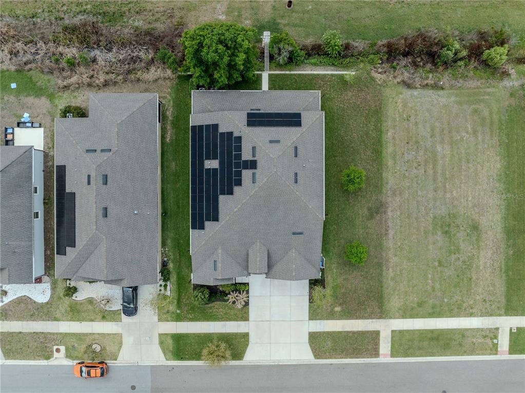 11701 Brighton Knoll Loop Riverview, FL 33579 - Photo 8 of 70 an aerial view of a house with a yard and large tree