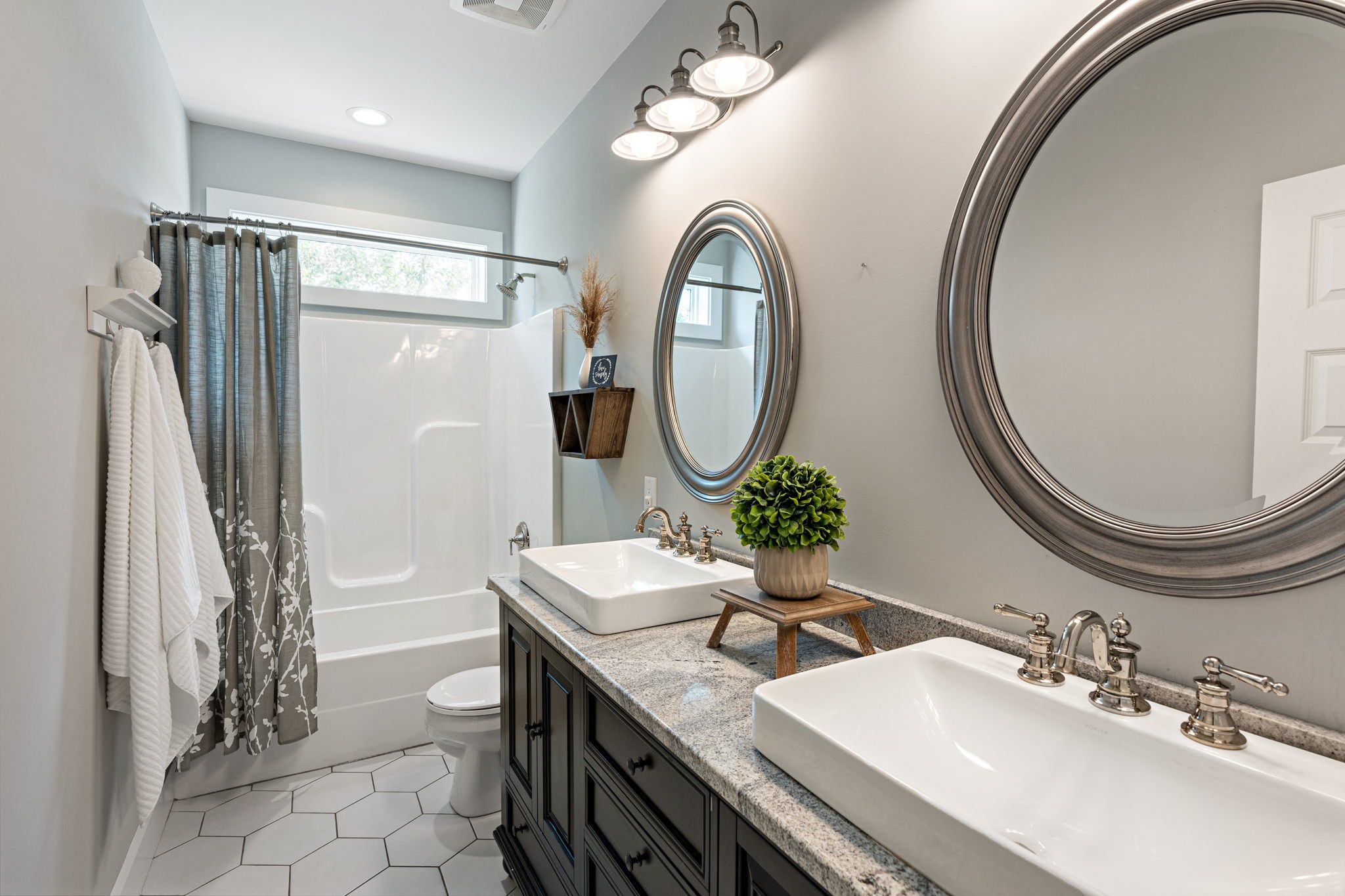 8518 Newtown Road Rockvale, TN 37153 - Photo 17 of 69 a bathroom with a sink a mirror a vanity and a shower