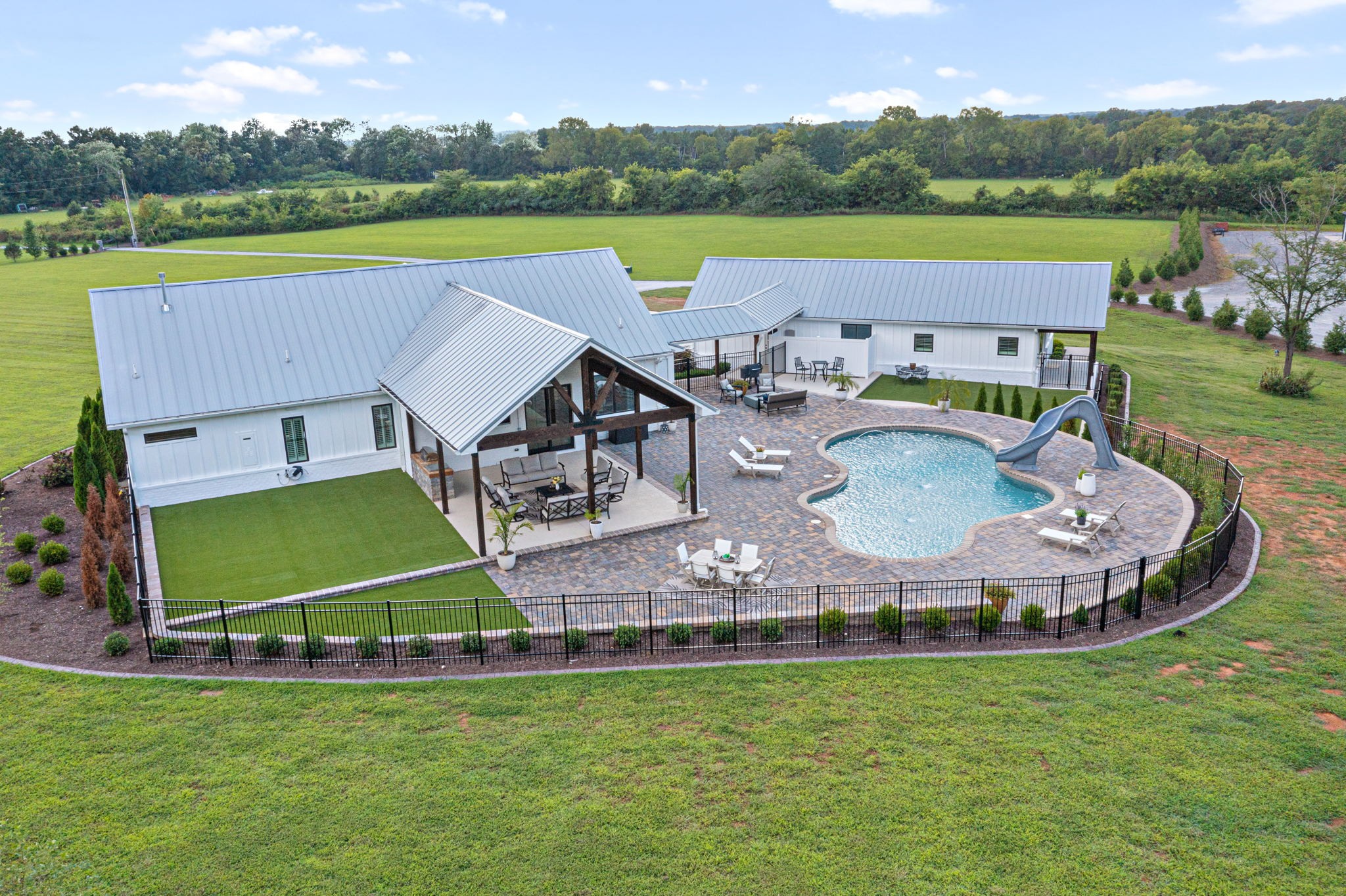 8518 Newtown Road Rockvale, TN 37153 - Photo 51 of 69 an aerial view of a house with a garden and a swimming pool