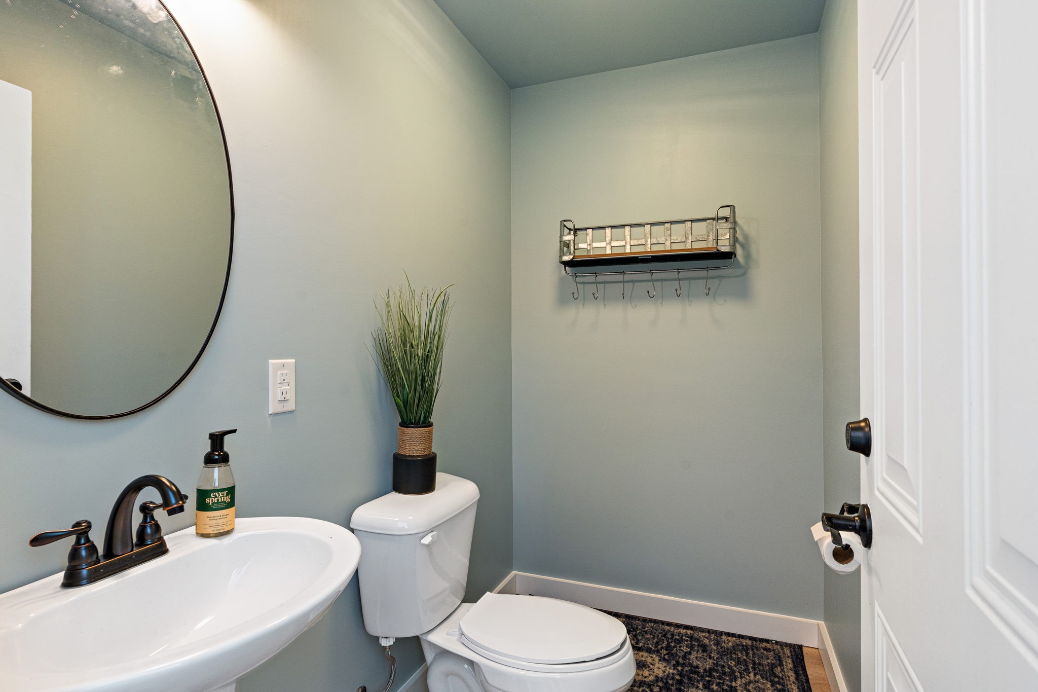 8518 Newtown Road Rockvale, TN 37153 - Photo 58 of 69 a bathroom with a sink and a mirror