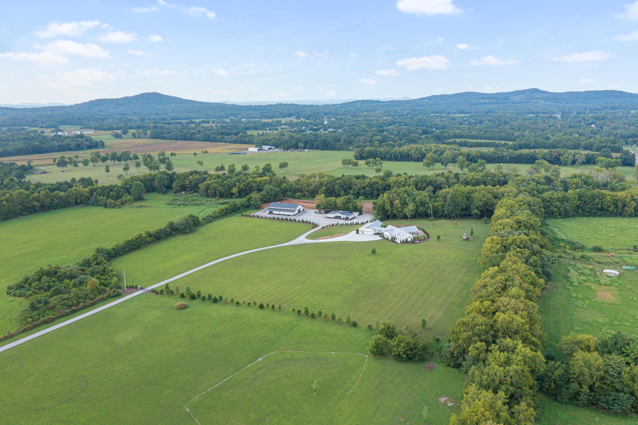 8518 Newtown Road Rockvale, TN 37153 - Photo 64 of 69 a view of a green field with mountains in the background