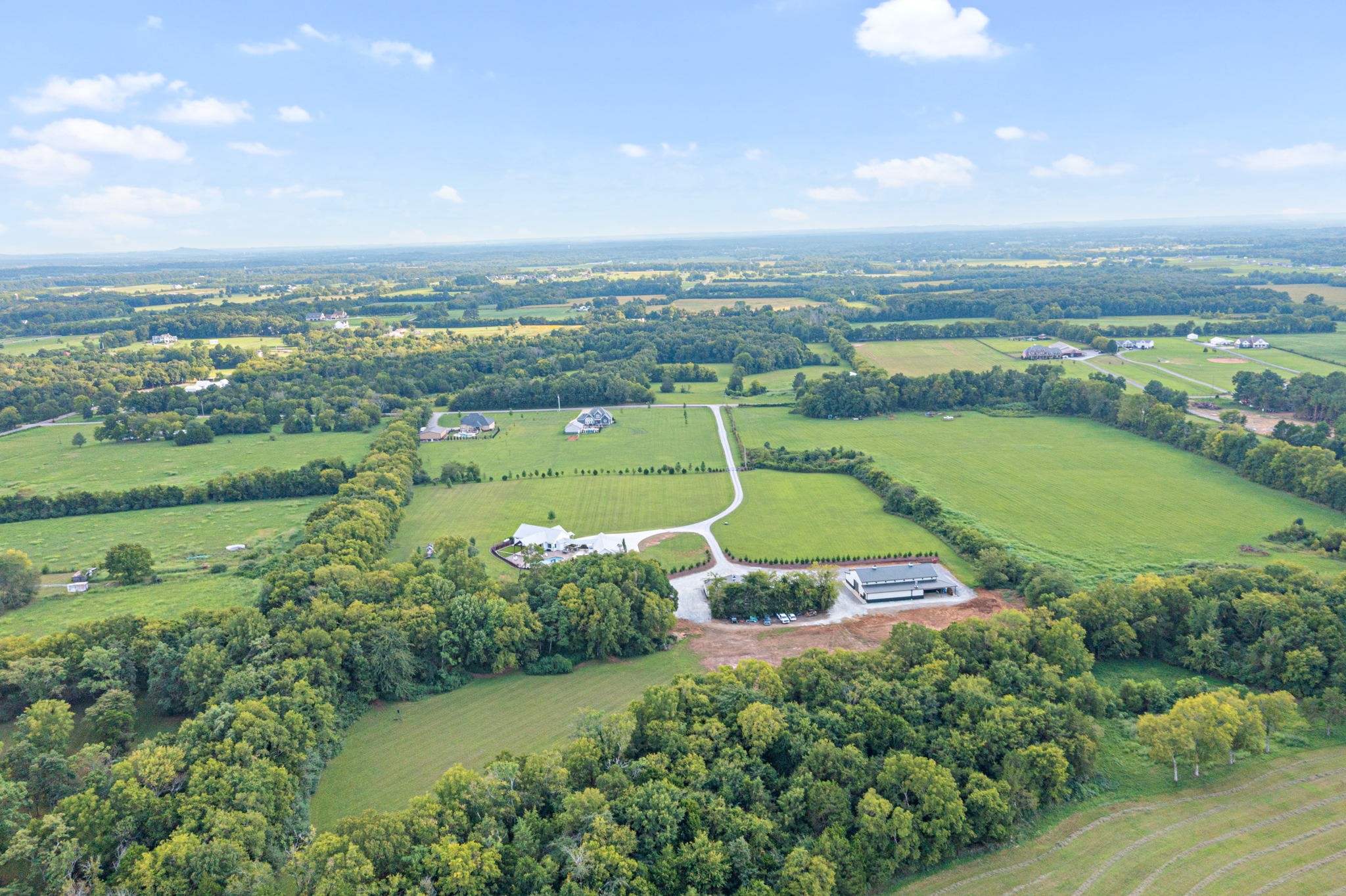 8518 Newtown Road Rockvale, TN 37153 - Photo 68 of 69 an aerial view of a city with lots of residential buildings and mountain view in back