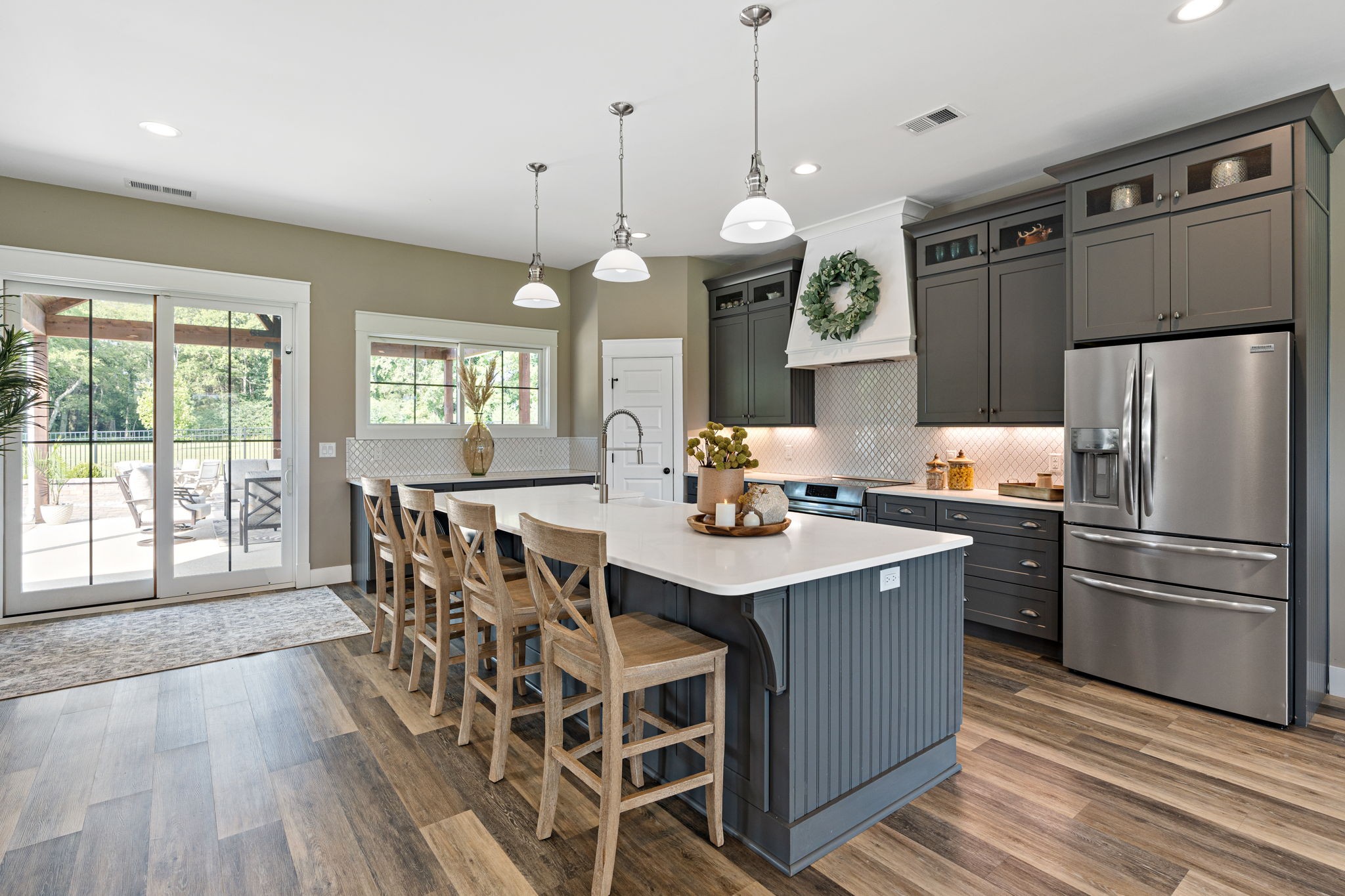 8518 Newtown Road Rockvale, TN 37153 - Photo 8 of 69 a kitchen with stainless steel appliances a dining table chairs stove and refrigerator