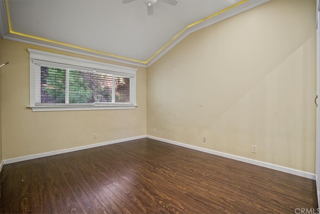 595 Windsor Place Laguna Beach, CA 92651 - Photo 16 of 26 a view of an empty room with wooden floor and a window