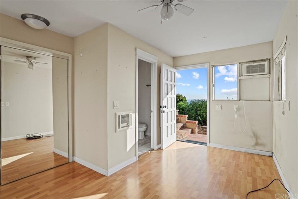 595 Windsor Place Laguna Beach, CA 92651 - Photo 19 of 26 a view of a livingroom with wooden floor and a kitchen space