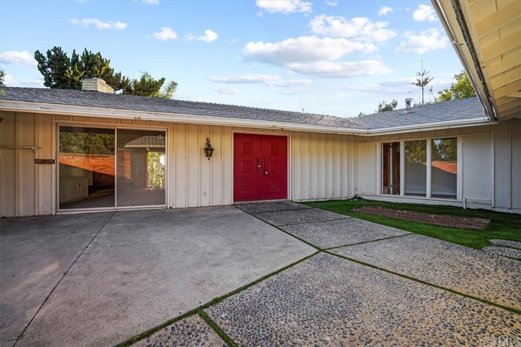 595 Windsor Place Laguna Beach, CA 92651 - Photo 5 of 26 a view of a house with a yard and a garage