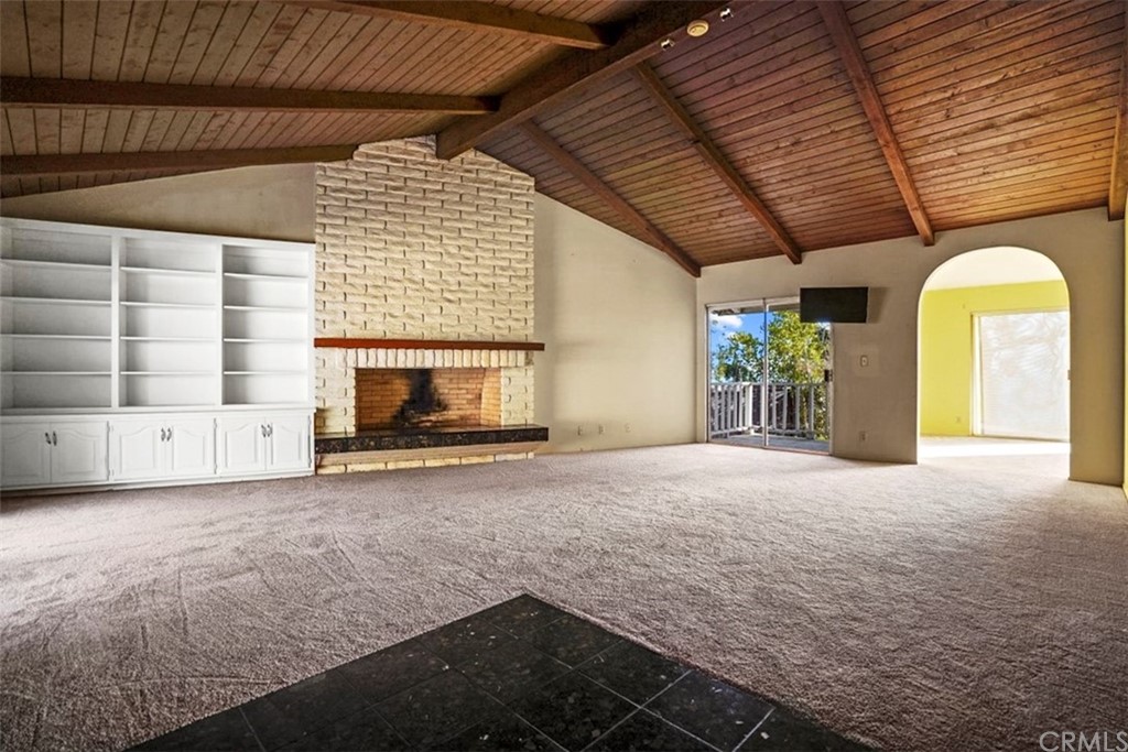 595 Windsor Place Laguna Beach, CA 92651 - Photo 6 of 26 a room with a fireplace and window