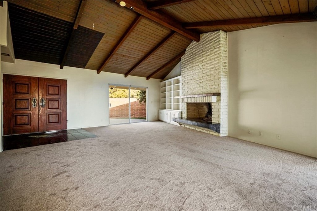 595 Windsor Place Laguna Beach, CA 92651 - Photo 7 of 26 a view of empty room with window and fireplace